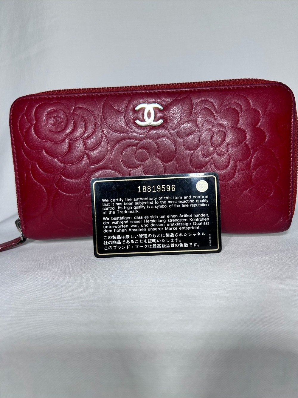Chanel Camellia Long Zippy Wallet leather embossed floral details silver CC logo